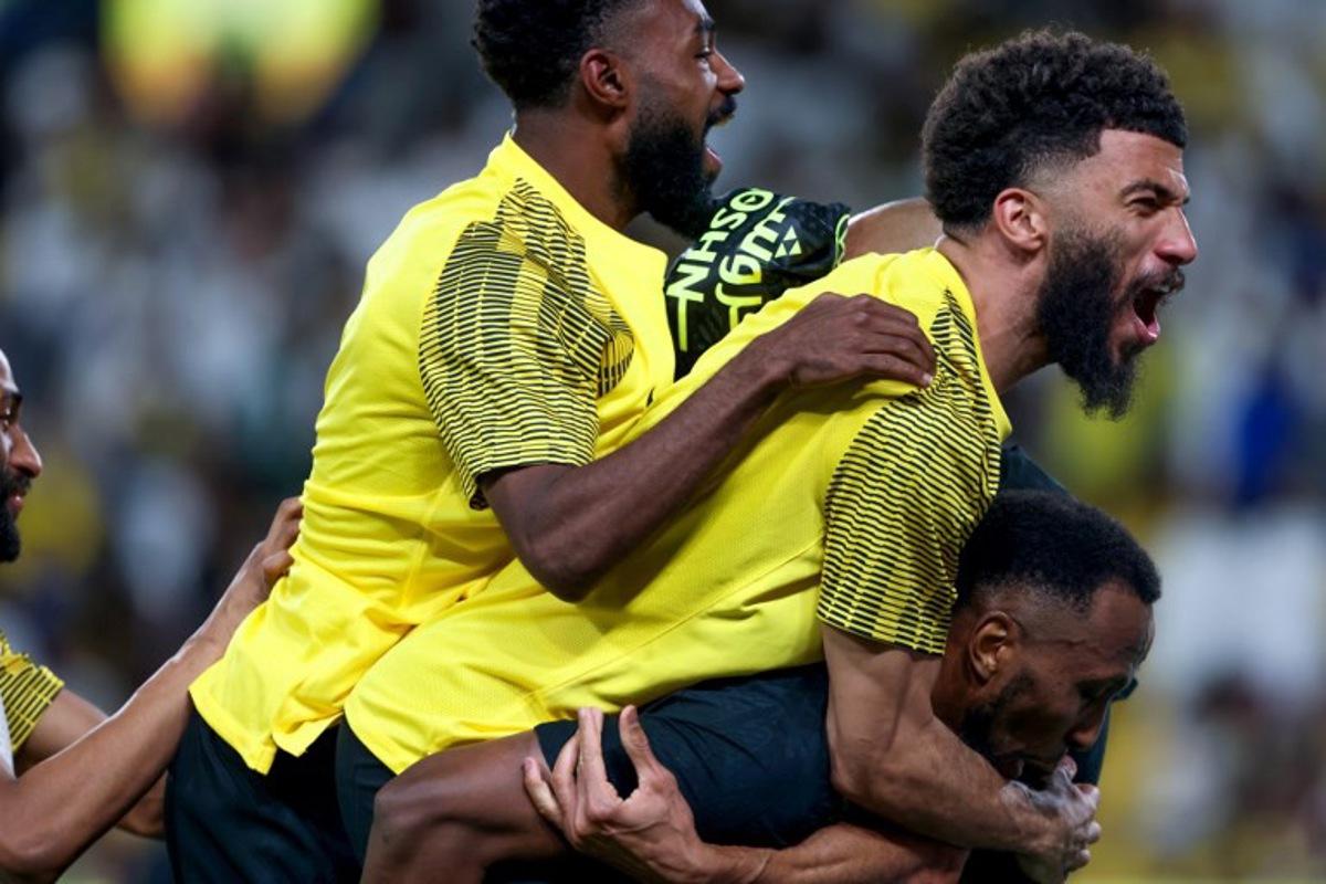 Ittihad's players celebrate their victory during the Saudi Pro League football match between Al-Nassr and Al-Ittihad at Al-Awwal Park in Riyadh on May 7, 2025. Fayez NURELDINE / AFP