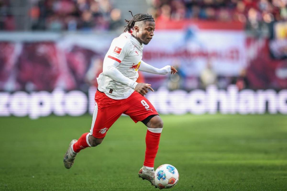 Leipzig's Belgian forward #09 Johan Bakayoko plays the ball during the German first division Bundesliga football match between RB Leipzig and Borussia Moenchengladbach in Leipzig, eastern Germany, on April 11, 2026. Ronny HARTMANN / AFP