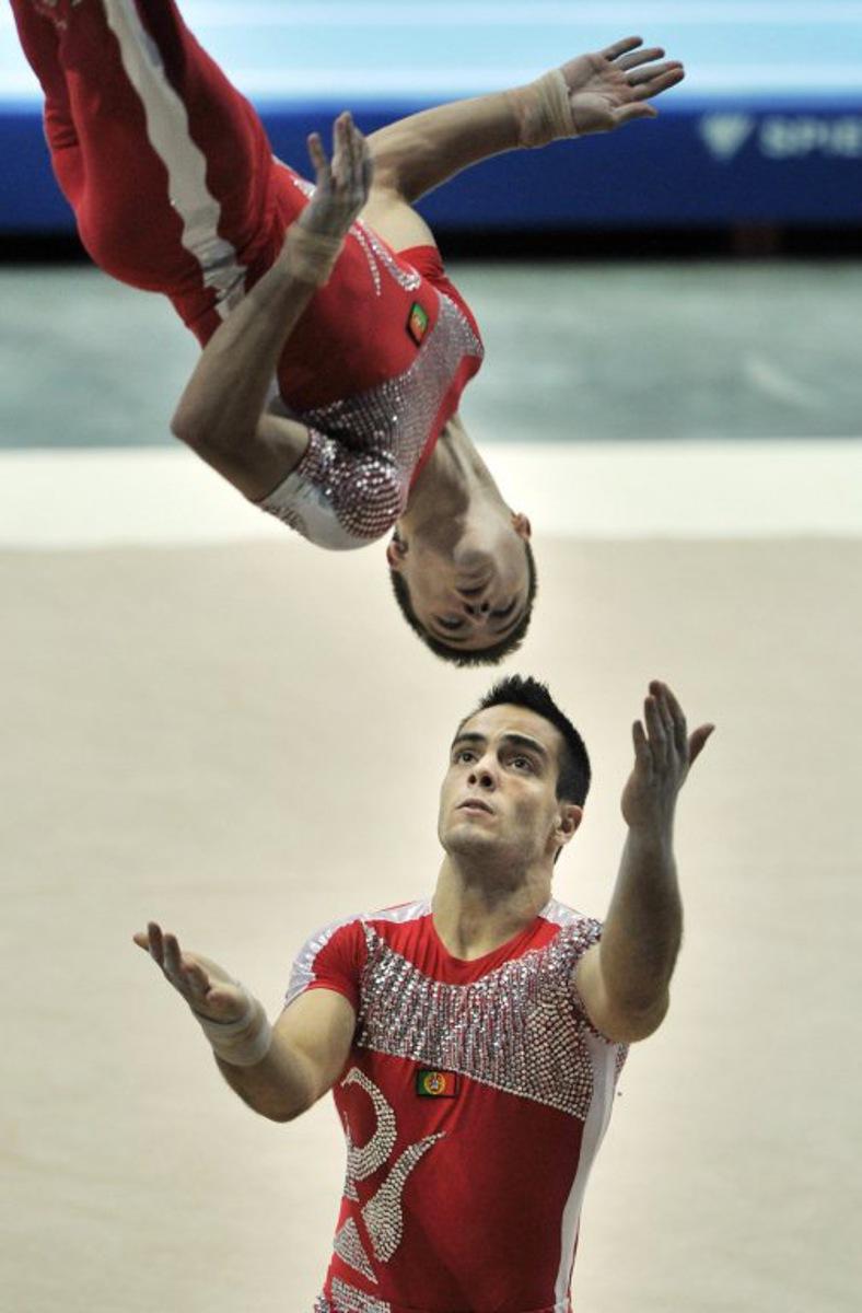 Portugese gymnasts Tiago Figueiredo (above) and Lourenco Franca compete in the acrobatic gymnastics men's pairs competition at the World Games in Kaohsiung on July 21, 2009. The World Games drew more than 4,700 athletes from across the globe to compete in 31 sports not included in the Olympics. AFP PHOTO/Sam YEH Sam YEH / AFP