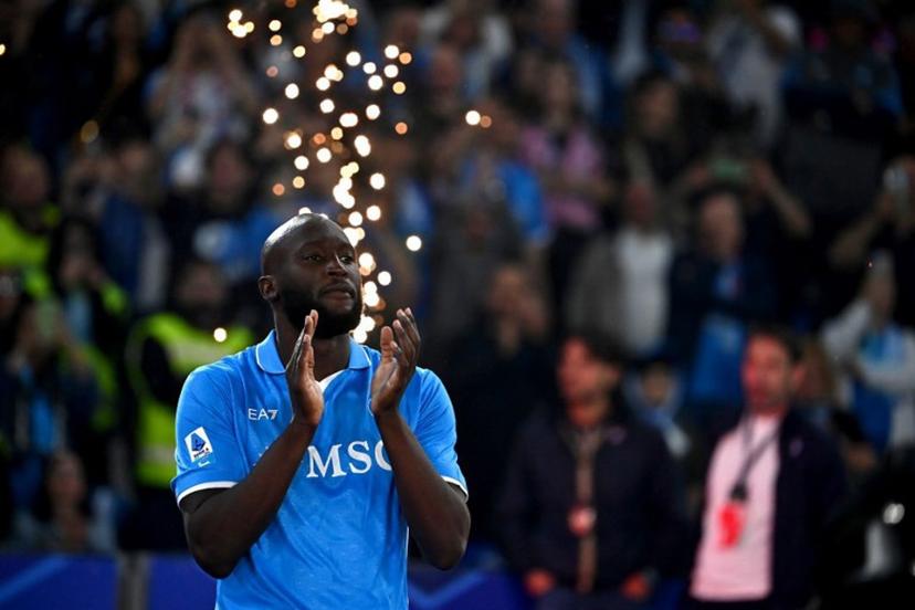 Napoli's Belgian forward #11 Romelu Lukaku applauds ahead of the trophy ceremony for the Italian Champions following the Italian Serie A football match between Napoli and Cagliari at the Diego Armando Maradona stadium in Naples on May 23, 2025. Isabella BONOTTO / AFP