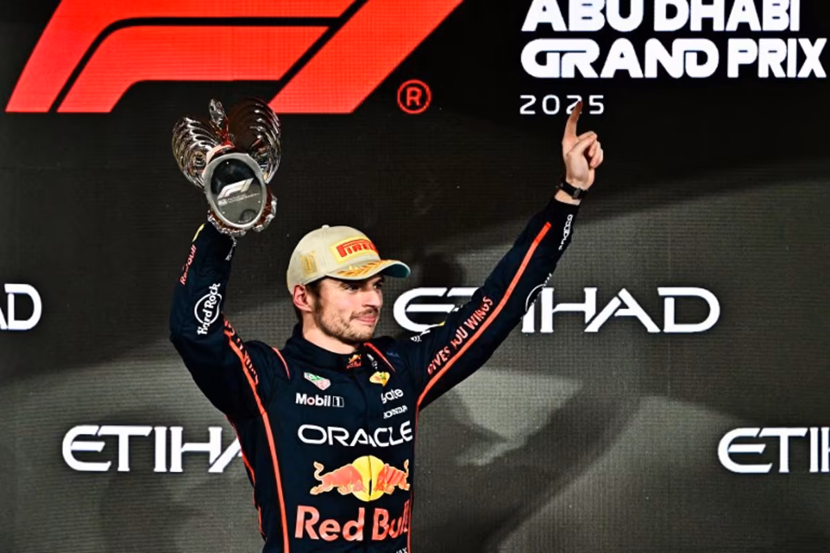 Race winner Red Bull Racing's Dutch driver Max Verstappen celebrates on the podium at the end of the Abu Dhabi Formula One Grand Prix at the Yas Marina Circuit in Abu Dhabi on December 7, 2025. Giuseppe CACACE / AFP