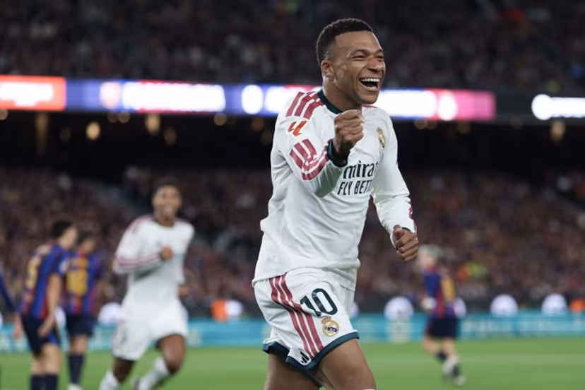 Real Madrid's French forward #10 Kylian Mbappe celebrates scoring his team's first goal during the Spanish league football match between FC Barcelona and Real Madrid CF at Camp Nou Stadium in Barcelona on October 25, 2026. Lluis GENE / AFP