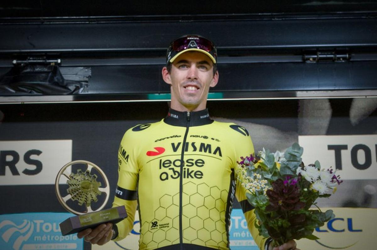 French rider of team Visma Lease A Bike Christophe Laporte celebrates on the podium after he won the 118th edition of the 213,9 km Paris-Tours one day cycling race, in Tours, central France on October 6, 2024. GUILLAUME SOUVANT / AFP