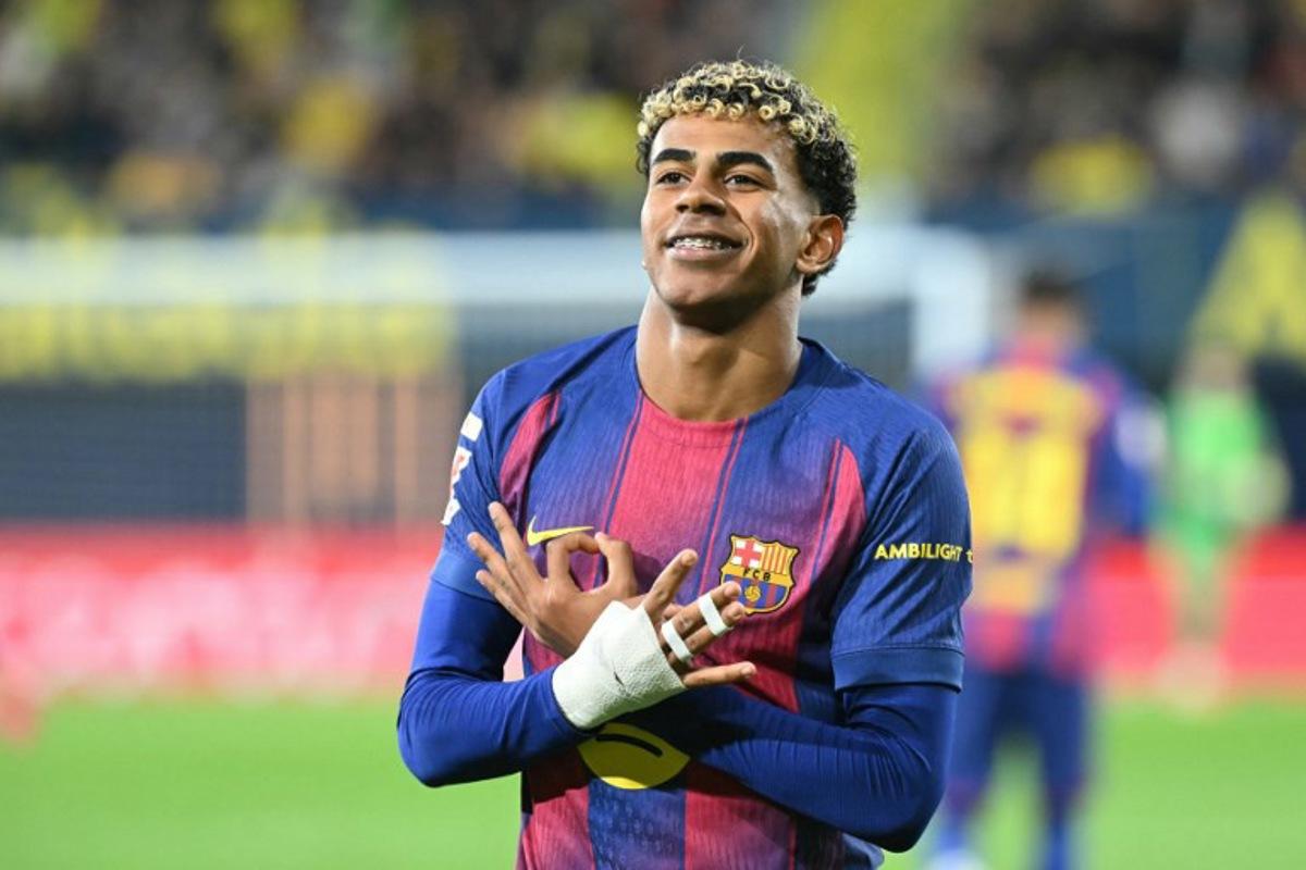 Barcelona's Spanish forward #10 Lamine Yamal celebrates scoring his team's second goal during the Spanish league football match between Villarreal CF and FC Barcelona at La Ceramica Stadium in Vila-real on December 21, 2025. JOSE JORDAN / AFP