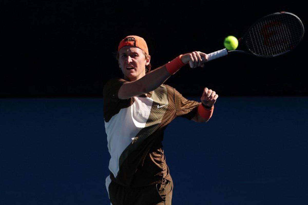 USA's Sebastian Korda hits a return to compatriot Michael Zheng during their men's singles match on day one of the Australian Open in Melbourne on January 18, 2026. IZHAR KHAN / AFP