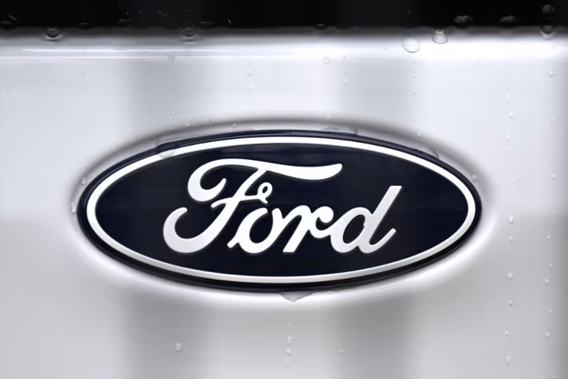 The logo of US car giant Ford is pictured on a car at a carseller in Gelsenkirchen, western Germany, on November 22, 2024. Ford on November 20, 2024 announced 4,000 more job cuts in Europe, mostly in Germany and Britain, in the latest blow to the continent's beleaguered car industry. Ina FASSBENDER / AFP