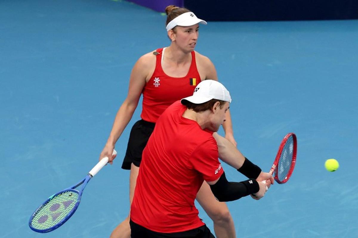 Belgium's Zizou Bergs (R) and Elise Mertens hit a return to China's Zhang Zhizhen and Zhu Lin during their mixed doubles match at the United Cup tennis tournament on Ken Rosewall Arena in Sydney on January 3, 2026. DAVID GRAY / AFP