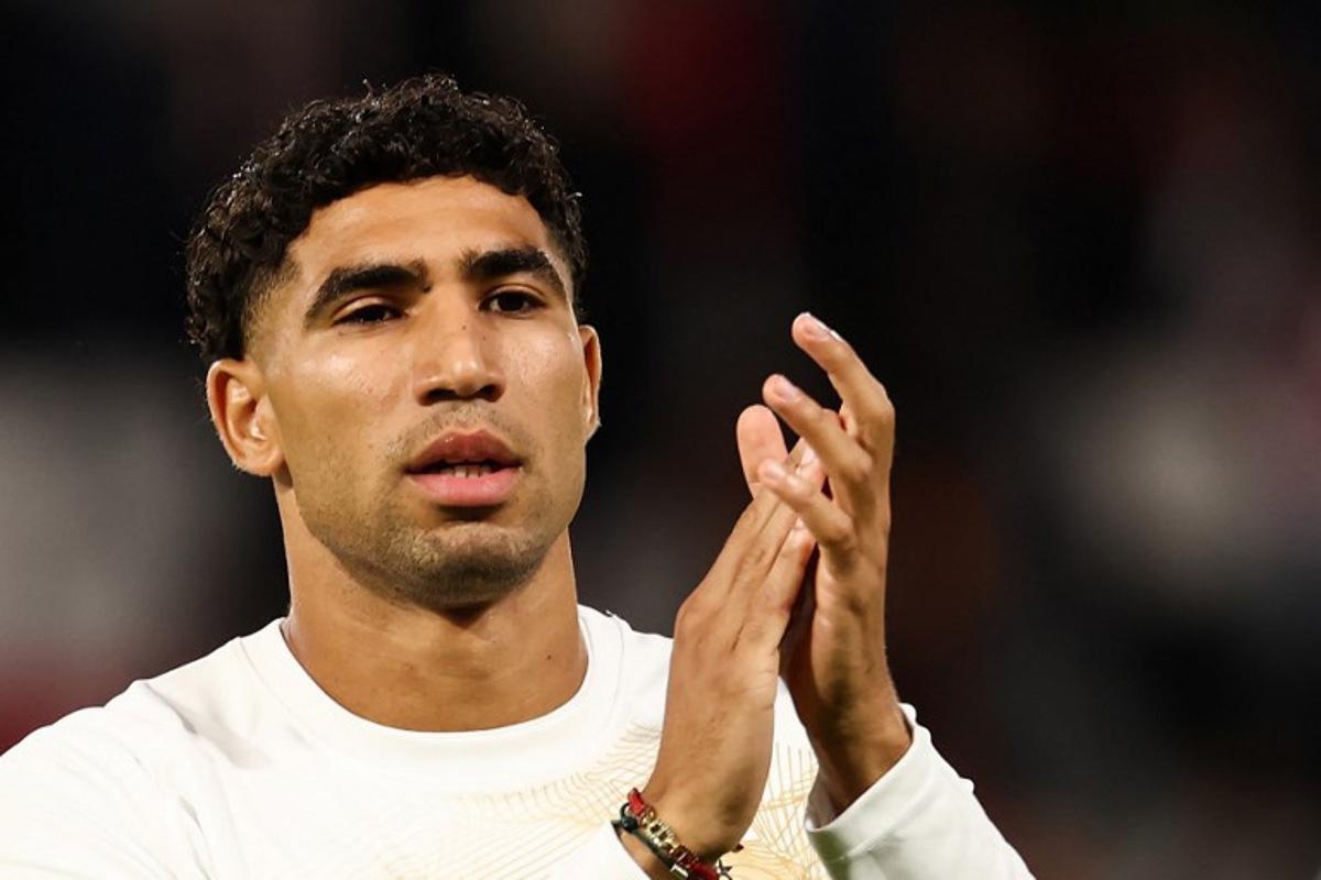 Paris Saint-Germain's Moroccan defender #02 Achraf Hakimi applauds as he warms up during the UEFA Champions League, league phase, matchday 1, football match between Paris Saint-Germain (PSG) and Slovan Bratislava at the Parc des Princes Stadium in Paris on September 9, 2026. FRANCK FIFE / AFP