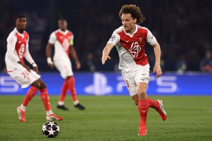 Monaco's Belgian defender #25 Wout Faes (R) gestures as he runs with the ball during the UEFA Champions League play-off second leg football match between Paris Saint-Germain (PSG) and AS Monaco at the Parc des Princes stadium in Paris on February 25, 2026. FRANCK FIFE / AFP
