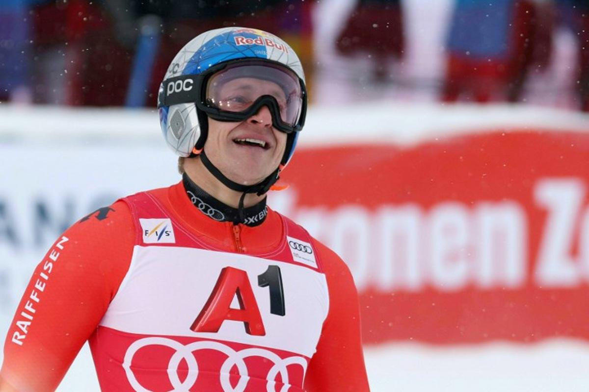 Switzerland's Marco Odermatt celebrates after winning after the men's giant slalom event of the FIS Alpine Skiing World Cup in Soelden, Austria on October 26, 2025. Johann GRODER / EXPA / APA / AFP