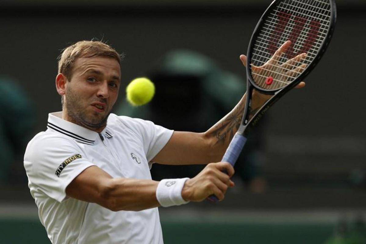 Britain's Dan Evans returns to US player Sebastian Korda during their men's singles third round match on the fifth day of the 2021 Wimbledon Championships at The All England Tennis Club in Wimbledon, southwest London, on July 2, 2021. Adrian DENNIS / AFP RESTRICTED TO EDITORIAL USE