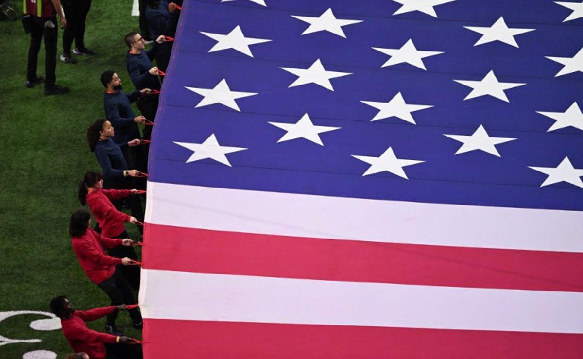 A giant US flag is displayed on the field ahead of Super Bowl LIX between the Kansas City Chiefs and the Philadelphia Eagles at Caesars Superdome in New Orleans, Louisiana, February 9, 2025. Chandan Khanna / AFP