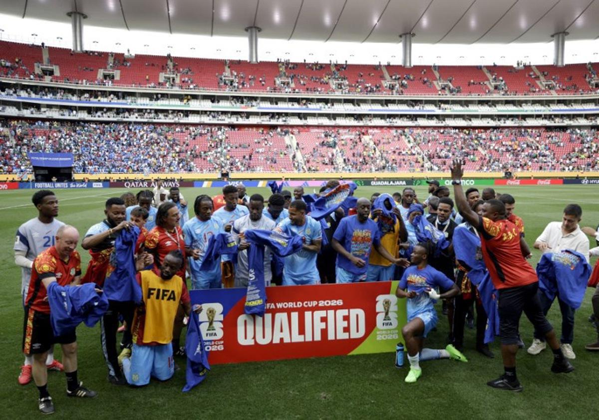 DR Congo players and coaching staff celebrate after winning the match and qualifying for the World Cup during the 2026 FIFA World Cup qualifiers final playoff football match between the Democratic Republic of the Congo and Jamaica at the Akron Stadium in Zapopan, Jalisco state, Mexico, on March 31, 2026. Ulises Ruiz / AFP