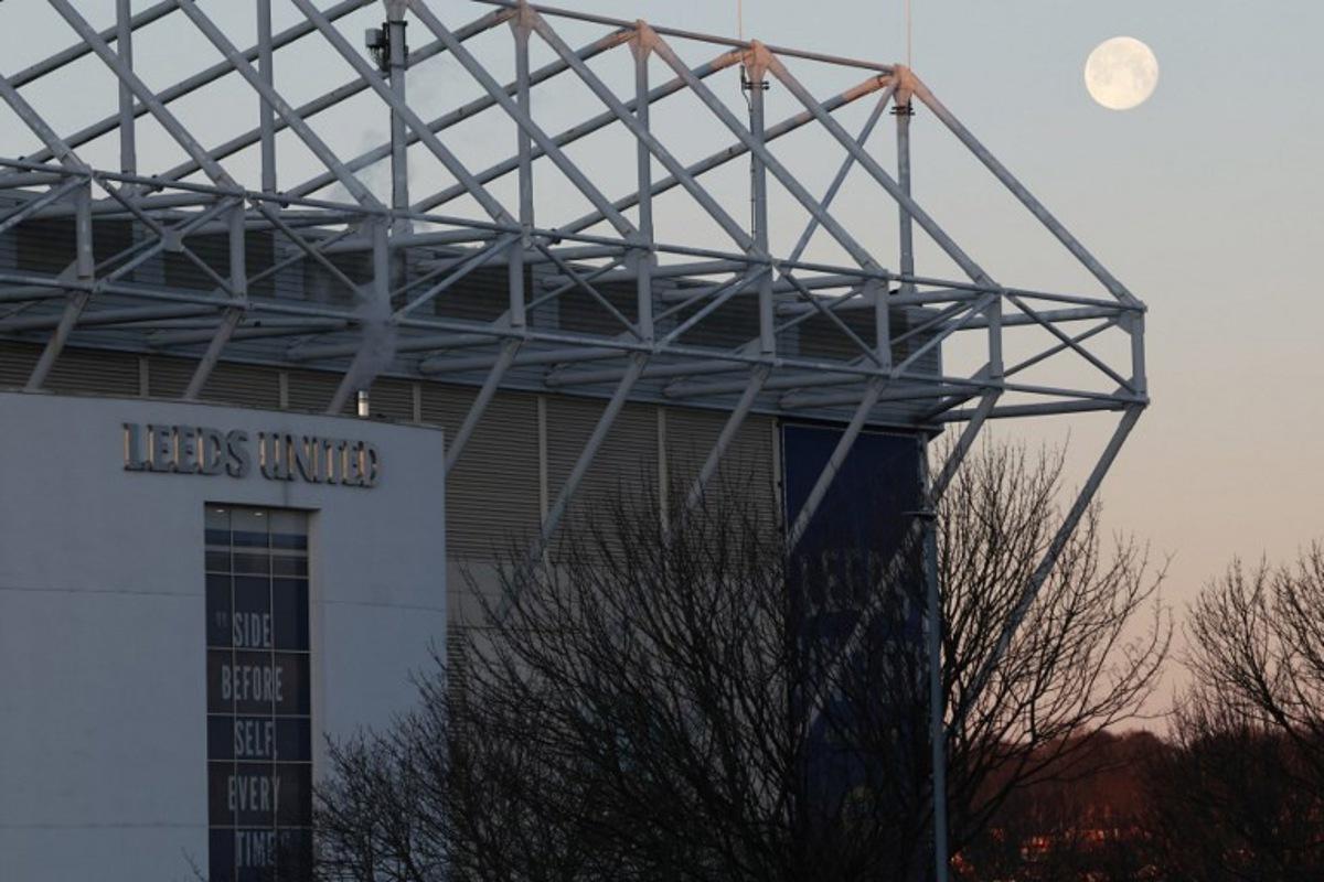 The moon sets and the sun rises at Elland Road in Leeds, northern England on January 4, 2026 ahead of the English Premier League football match between Leeds United and Manchester United. Darren Staples / AFP