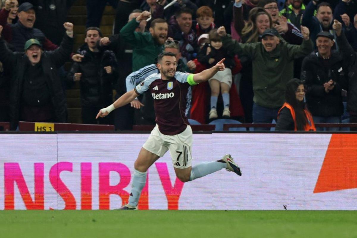 Aston Villa's Scottish midfielder #07 John McGinn celebrates scoring the opening goal during the UEFA Europa League, round of 16 second-leg football match between Aston Villa and Lille LOSC at Villa Park in Birmingham, central England on March 19, 2026. Darren Staples / AFP
