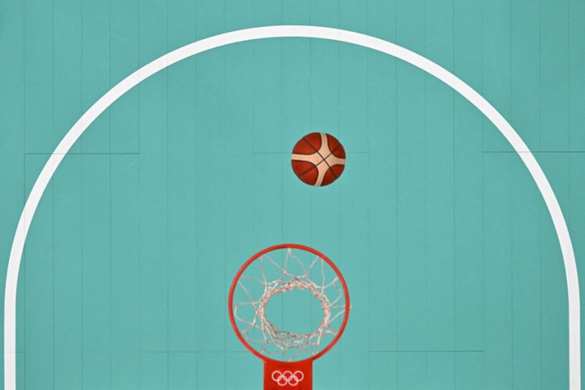 An overview shows the ball rebound in the women's preliminary round group A basketball match between Spain and China during the Paris 2024 Olympic Games at the Pierre-Mauroy stadium in Villeneuve-d'Ascq, northern France, on July 28, 2024. Sameer Al-DOUMY / POOL / AFP