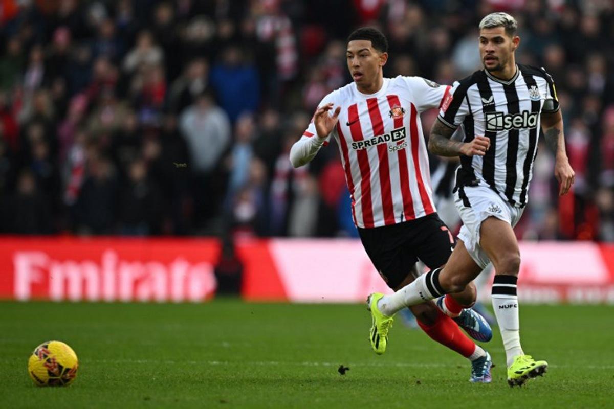 Sunderland's English midfielder #07 Jobe Bellingham (L) vies with Newcastle United's Brazilian midfielder #39 Bruno Guimaraes (R) during the English FA Cup third round football match between Sunderland and Newcastle United at The Stadium of Light in Sunderland in north east England on January 6, 2024. Paul ELLIS / AFP