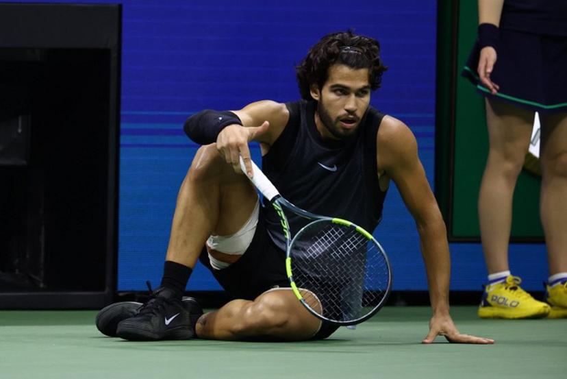 Spain's Carlos Alcaraz recovers after falling during the men's singles quarter-final tennis match against USA's Ben Shelton on day ten of the US Open tennis tournament at the USTA Billie Jean King National Tennis Center in New York City on September 9, 2026. Leonardo MUNOZ / AFP