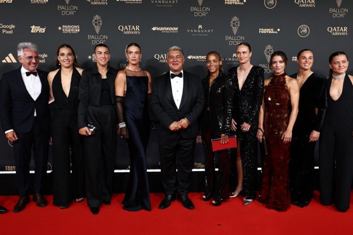 FC Barcelona's President Joan Laporta (C) poses with Barcelona's Spanish midfielder and Ballon d'Or 2024 winner Aitana Bonmati (5thL) and Barcelona's players Laia Aleixandri (3rdL), Cata Coll (2ndL), Vicky (5thR), Caroline Graham (4thL), Patricia Guijarro (3rdL) and Ewa Pajor (2ndR) upon arrival before the 2025 Ballon d'Or France Football award ceremony at the Theatre du Chatelet in Paris on September 22, 2025 FRANCK FIFE / AFP