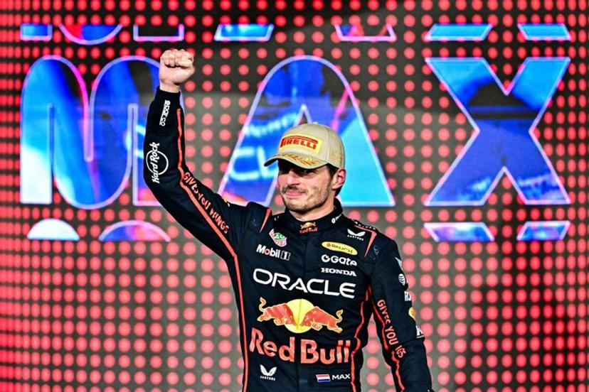 Race winner Red Bull Racing's Dutch driver Max Verstappen celebrates on the podium at the end of the Abu Dhabi Formula One Grand Prix at the Yas Marina Circuit in Abu Dhabi on December 7, 2025. Giuseppe CACACE / AFP