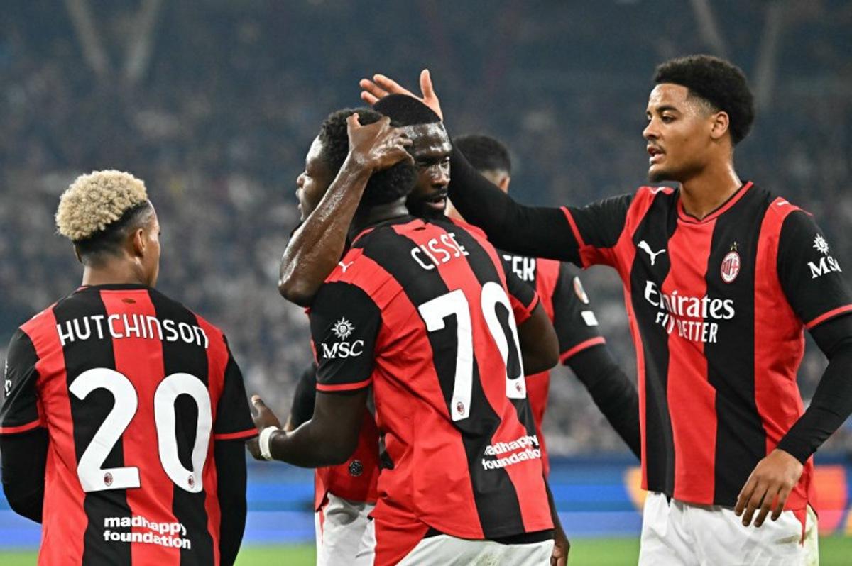 AC Milan's Italian midfielder #70 Alphadjo Cisse (C) celebrates with teammates scoring the opening goal during the UEFA Europa League football match between Salzburg and AC Milan in Salzburg, on October 15, 2026. Joe Klamar / AFP