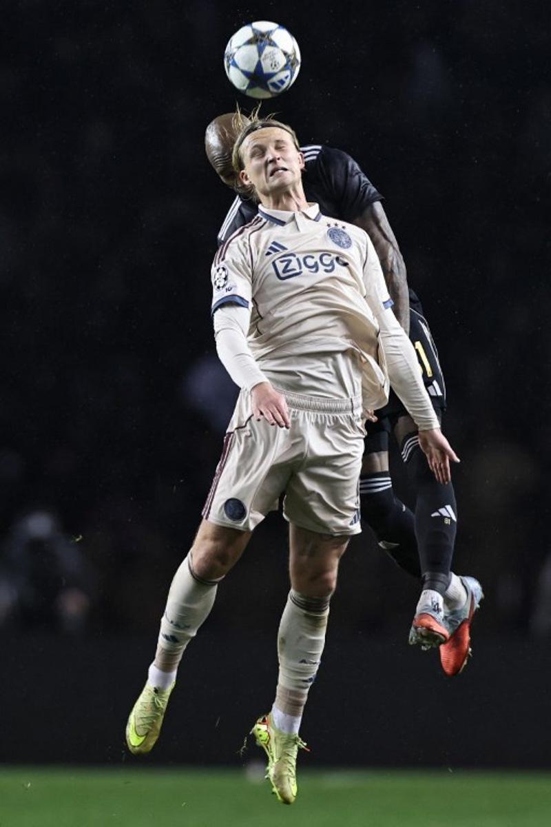 Ajax's Danish forward #09 Kasper Dolberg and Qarabag's Colombian defender #81 Kevin Medina vie for the ball during the UEFA Champions League league phase football match between Qarabag and Ajax at the Tofiq Bahramov Republican Stadium in Baku on December 10, 2025. Giorgi ARJEVANIDZE / AFP
