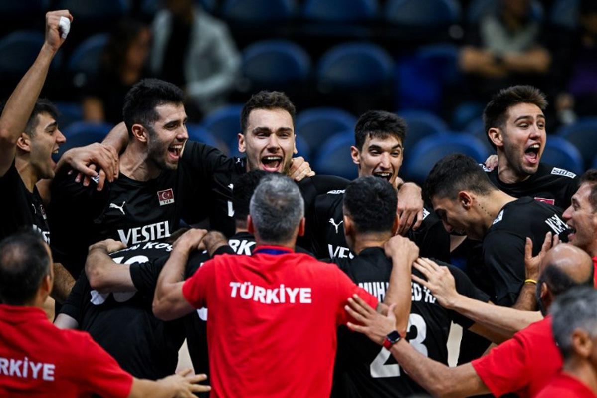 Team Turkey celebrate after a point against Canada during the 2025 Men's Volleyball World Championship at Araneta Coliseum in Quezon City, metro Manila on September 17, 2025. SHERWIN VARDELEON / AFP