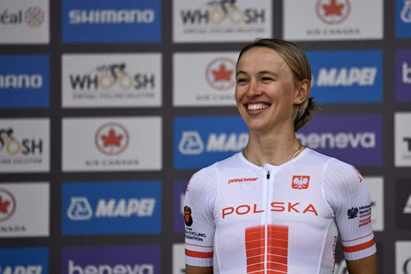 Second-placed Katarzyna Niewiadoma of Poland smiles on the podium after the Women's Elite Road Race at the 2026 Union Cycliste Internationale (UCI) Road World Championships in Montreal, Quebec, on September 26, 2026. Andrej Ivanov / AFP