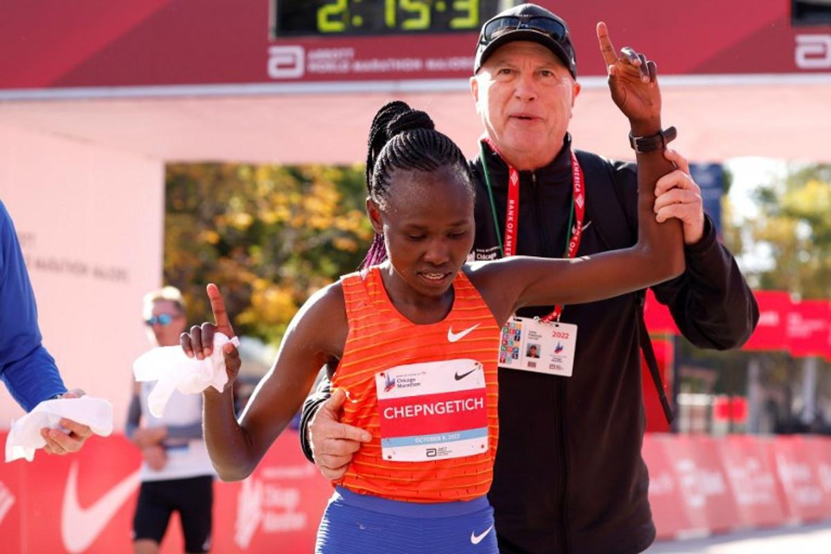 Kenya's Ruth Chepngetich celebrates after crossing the finish line to place first in the women's division of the 2022 Bank of America Chicago Marathon in Chicago, Illinois, on October 9, 2022. KAMIL KRZACZYNSKI / AFP