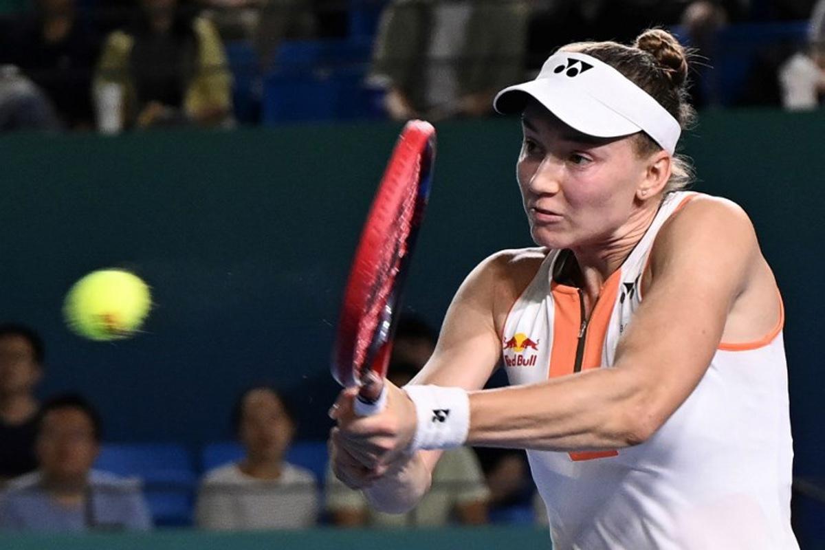 Kazakhstan's Elena Rybakina hits a return to Italy's Jasmine Paolini during their women's singles semi-final match at the WTA Ningbo Open tennis tournamen in Ningbo, in China's eastern Zhejiang province on October 18, 2025. AFP