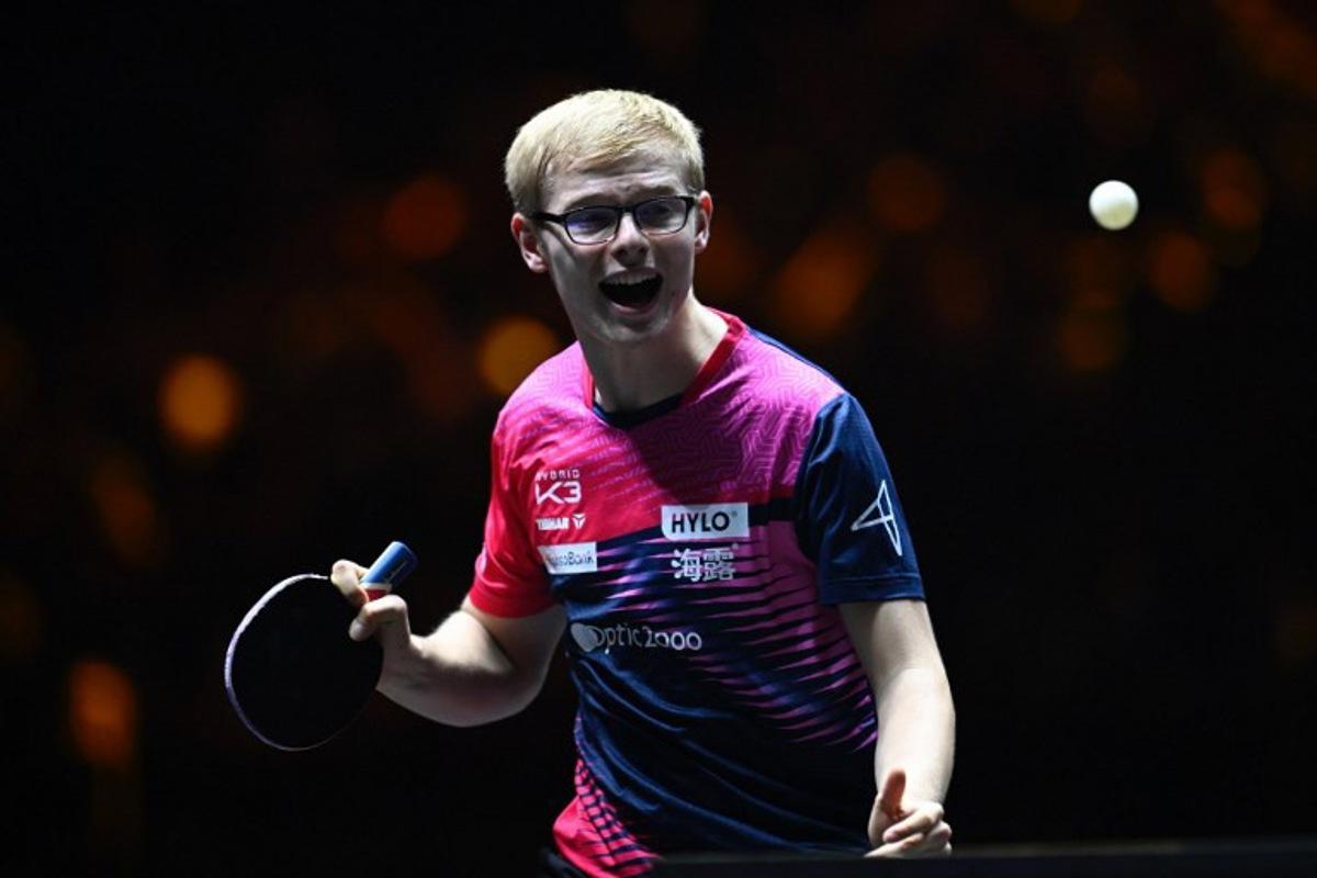 France's Felix Lebrun reacts after a point against China's Wang Chuqin during their men's singles final match at the China Smash Table Tennis 2025 tournament in Beijing on October 5, 2025. WANG Zhao / AFP