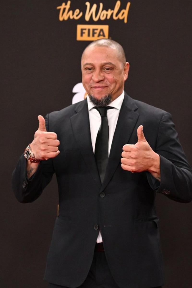 Former Brazilian player Roberto Carlos poses on the red carpet upon arrival to attend the draw for the 2026 FIFA Football World Cup taking place in the US, Canada and Mexico, at the Kennedy Center, in Washington, DC, on December 5, 2025. Roberto SCHMIDT / AFP