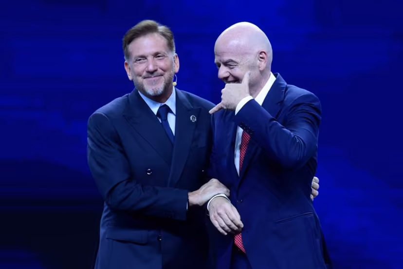 FIFA President Gianni Infantino (R) gestures next to CONMEBOL President Alejandro Dominguez (L) during a commemorative event marking the 10th anniversary of Dominguez's work as the head of the South American Football Confederation in Luque, Paraguay on January 26, 2026. Daniel DUARTE / AFP