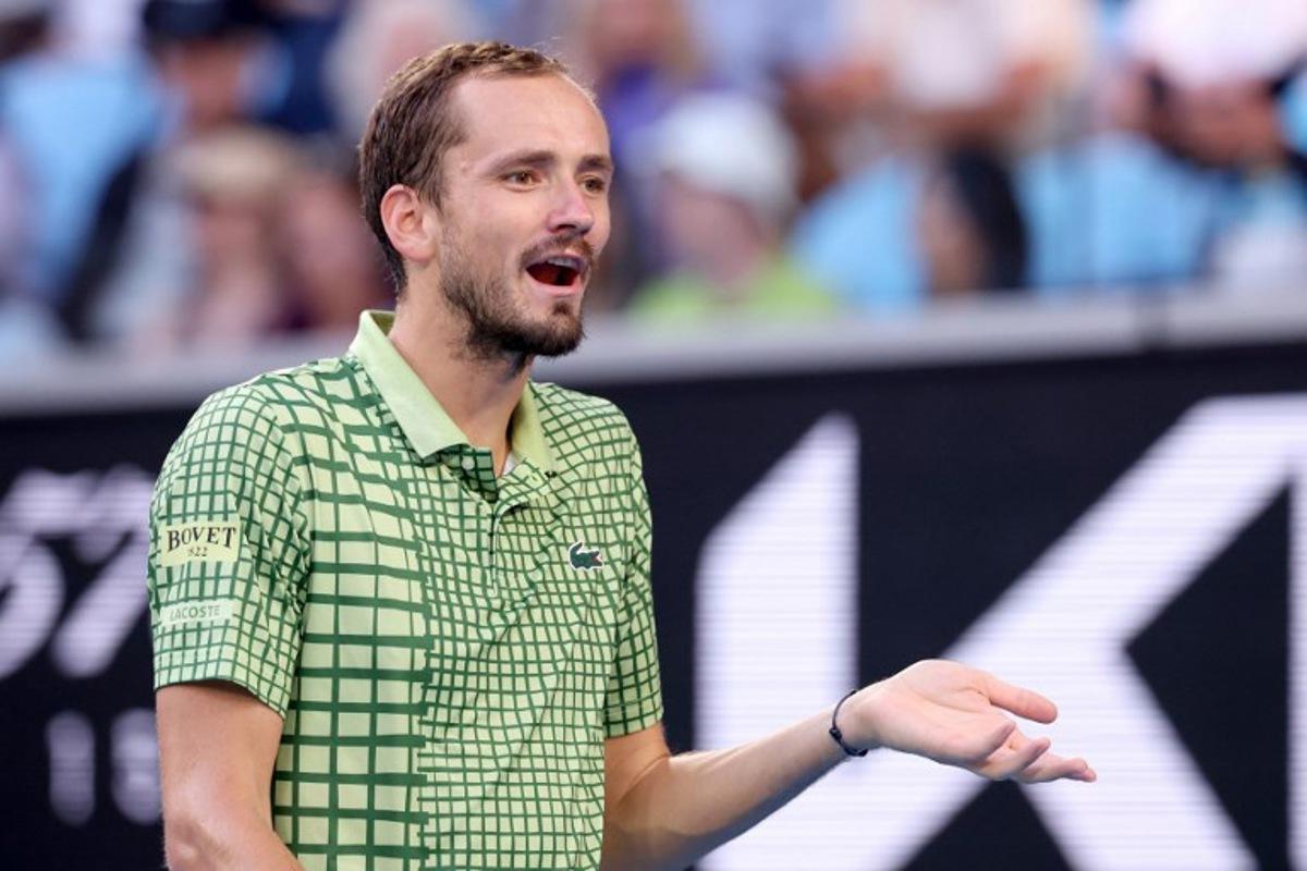 Russia's Daniil Medvedev reacts on a point to USA's Learner Tien during their men's singles match on day eight of the Australian Open tennis tournament in Melbourne on January 25, 2026. DAVID GRAY / AFP