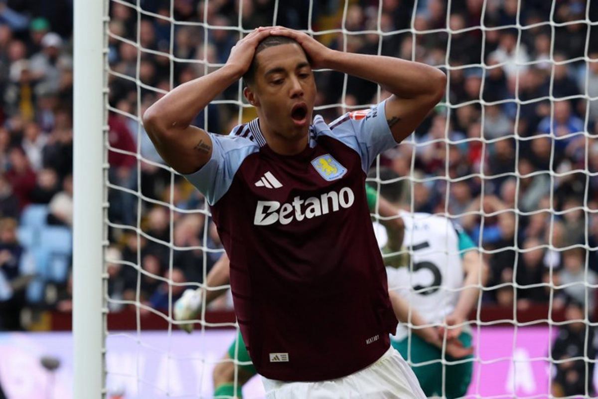 Aston Villa's Belgian midfielder #08 Youri Tielemans reacts after his shot hit the post during the English Premier League football match between Aston Villa and Newcastle United at Villa Park in Birmingham, central England on April 19, 2025. Darren Staples / AFP