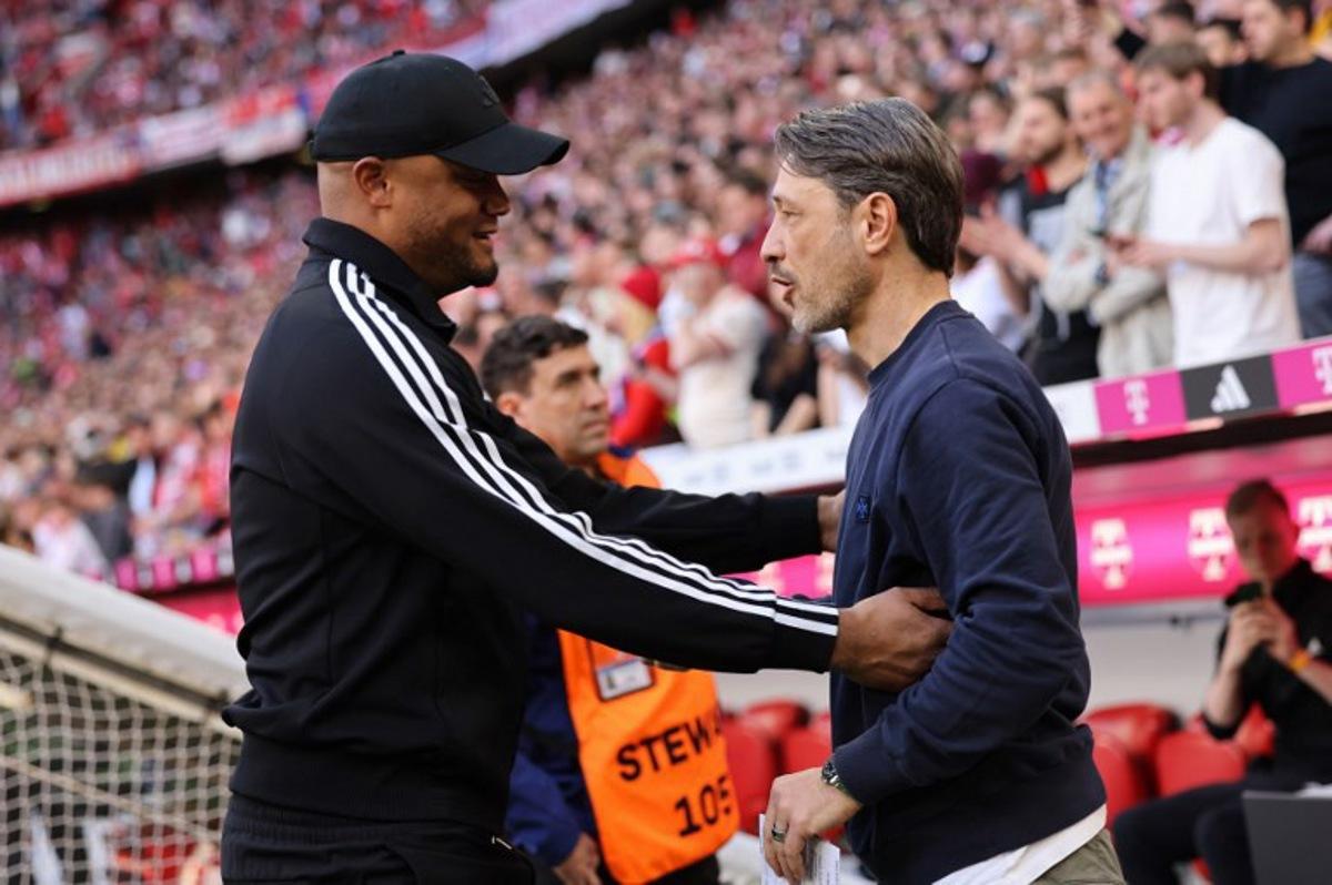 Bayern Munich's Belgian head coach Vincent Kompany (L) greets Dortmund's Croatian head coach Niko Kovac ahead the German first division Bundesliga football match between Bayern Munich and Borussia Dortmund in Munich, southern Germany, on April 12, 2025. Alexandra BEIER / AFP