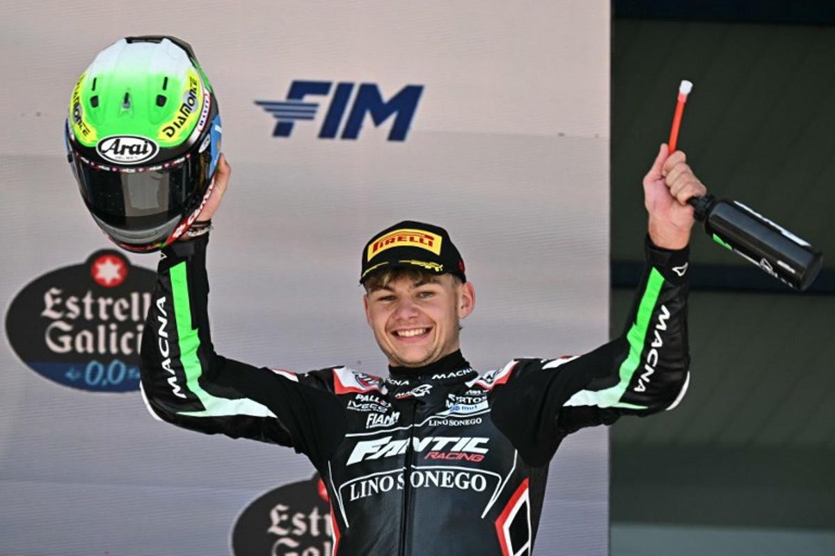 Second placed Fantic Racing's Belgian rider Barry Baltus celebrates on the podium after the Spanish Moto2 Grand Prix at the Jerez racetrack in Jerez de la Frontera, on April 27, 2025. JAVIER SORIANO / AFP