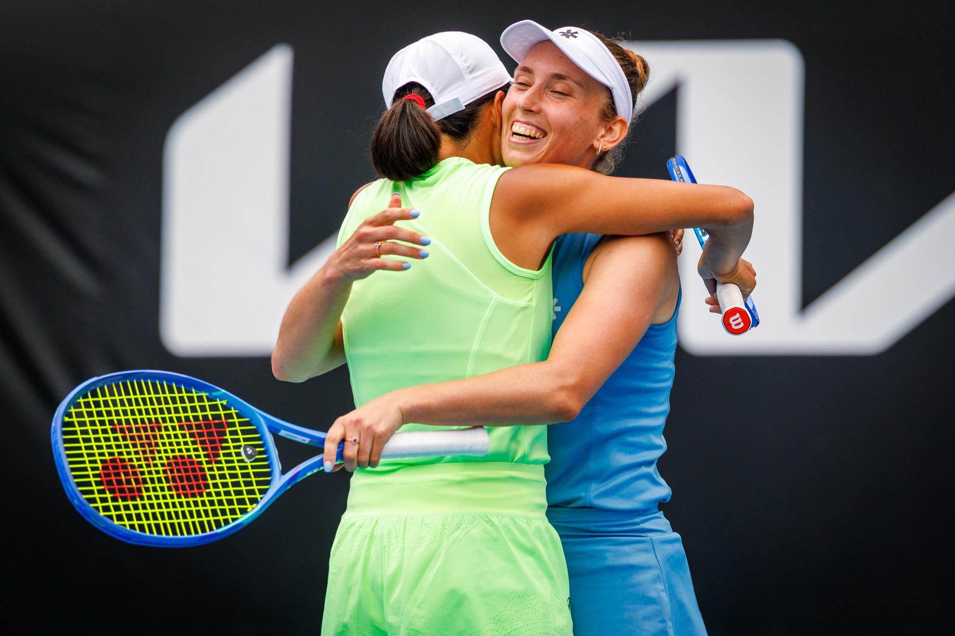 Belgian Elise Mertens (R) and her Chinese partner Shuai Peng celebrate during a doubles tennis match against Taiwanese-Japanese pair Wu-Hozumi, in the quarterfinals of the women doubles at the Australian Open, Melbourne Park, Melbourne on Wednesday 28 January 2026. Mertens - Zhang won the game. BELGA PHOTO PATRICK HAMILTON --- BENELUX ONLY ---