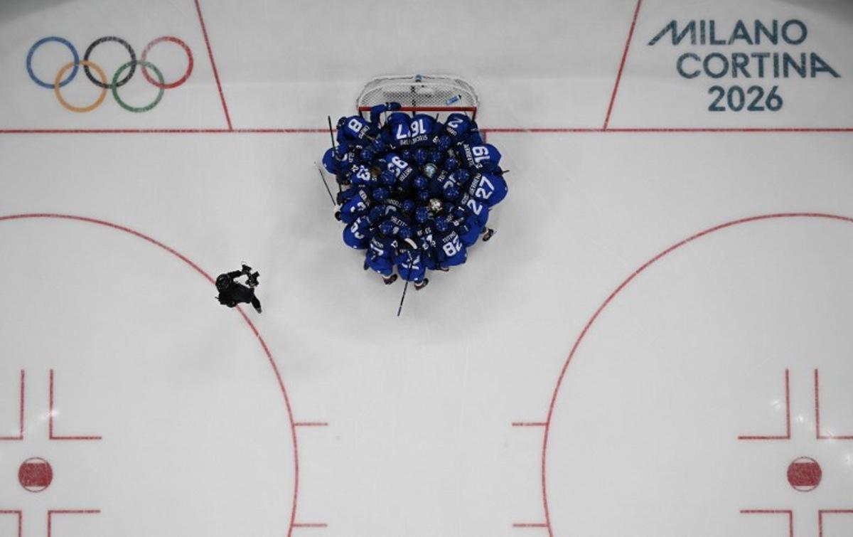 Italy's players huddle before the women's preliminary round group B Ice Hockey match between Italy and France at the Milano Santagiulia Ice Hockey Arena during the Milano Cortina 2026 Winter Olympic Games in Milan, on February 5, 2026. JULIEN DE ROSA / AFP