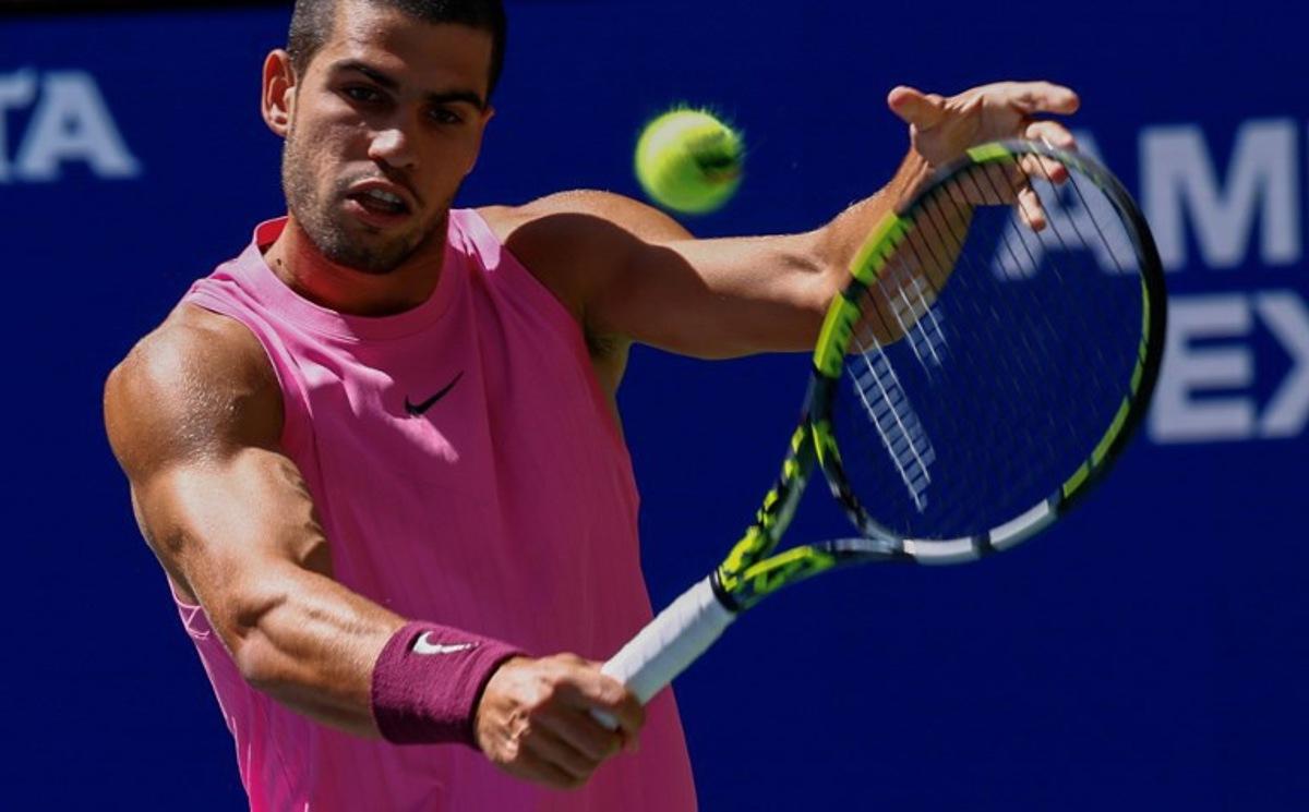 Spain's Carlos Alcaraz plays a backhand return to Czech Republic's Jiri Lehecka during their men's singles quarterfinal tennis match on day ten of the US Open tennis tournament at the USTA Billie Jean King National Tennis Center in New York City, on September 2, 2025. Kena Betancur / AFP