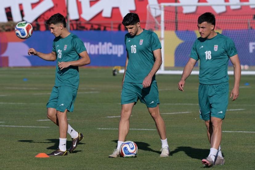 Iran's defender #25 Danial Iri, midfielder #16 Mehdi Torabi, and forward #18 Amirhossein Hosseinzadeh take part in a training session during the 2026 World Cup football tournament at the Centro Xoloitzcuintle in Tijuana, Mexico on June 12, 2026. Guillermo Arias / AFP
