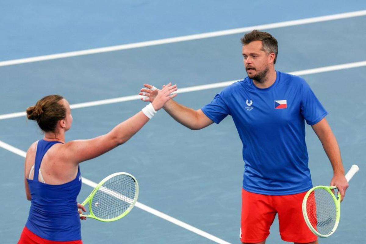 Czech Republic's Adam Pavlasek (R) and Barbora Krejcikova celebrate their victory against Norway's Viktor Durasovic and Ulrikke Eikeri in their mixed-doubles match at the United Cup tennis tournament on Ken Rosewood Arena in Sydney on January 5, 2026. Izhar KHAN / AFP