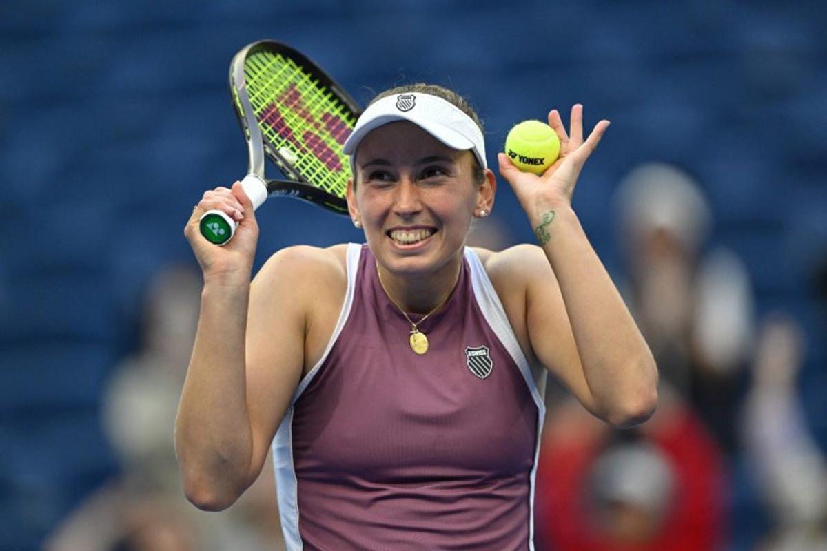 Belgium's Elise Mertens reacts as she celebrates her victory against USA's Coco Gauff during their women's singles match at the China Open tennis tournament in Beijing on October 7, 2026. Adek BERRY / AFP