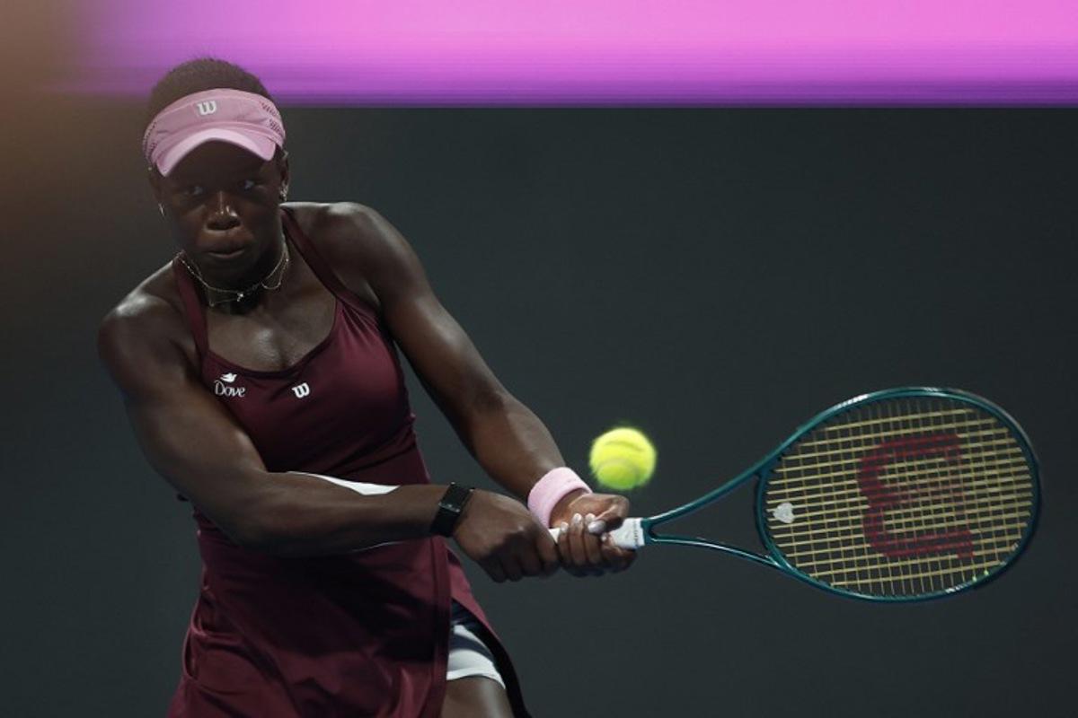 Canada's Victoria Mboko hits a return against Latvia's Jelena Ostapenko during their women's singles semi-final match at the Qatar Open tennis tournament in Doha on February 13, 2026. Karim JAAFAR / AFP