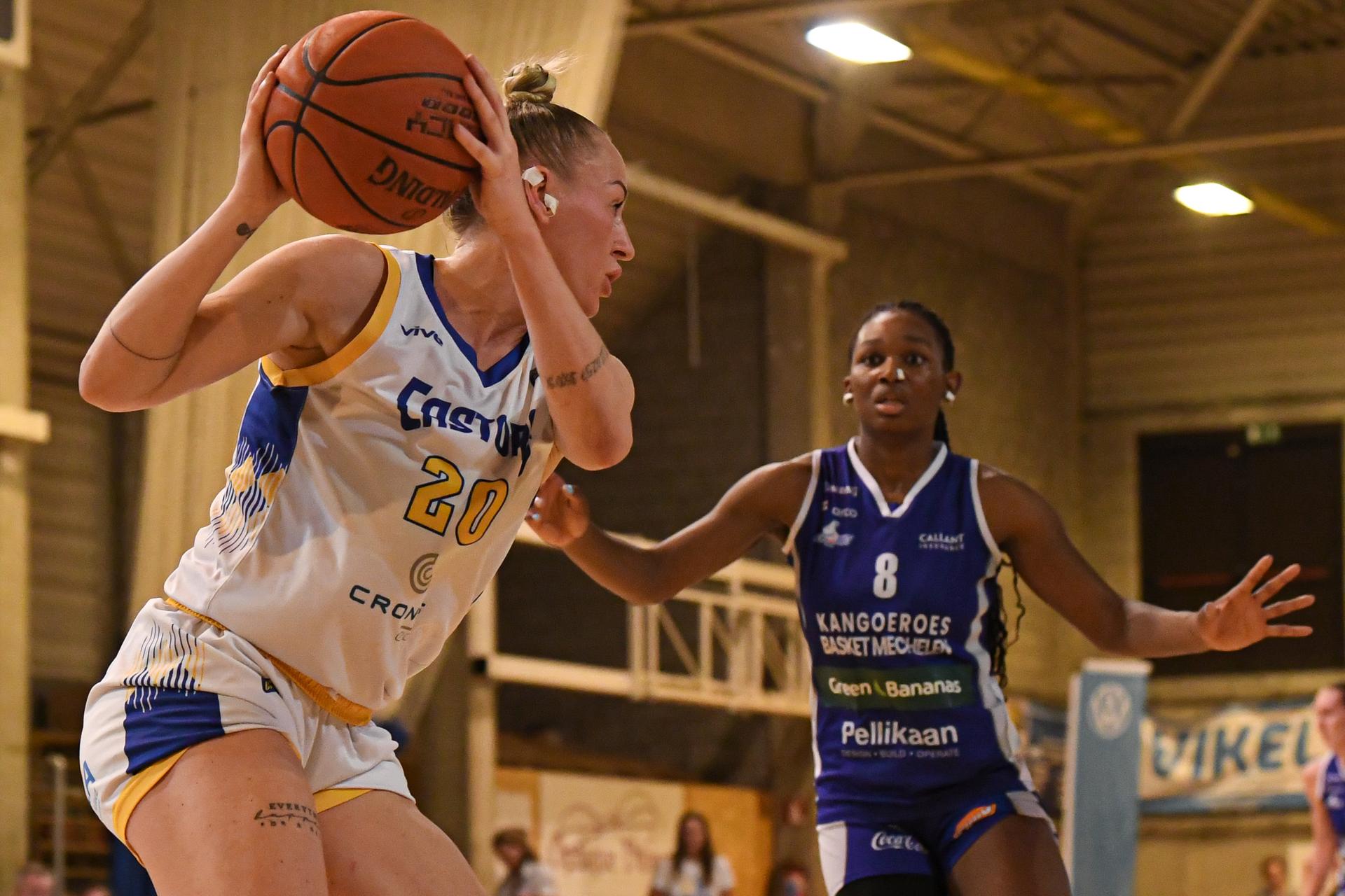 Castors' Santa Okockyte and Mechelen's Annie Kibedi pictured in action during a basketball match between Royal Castors Braine and Kangoeroes Mechelen, Tuesday 22 April 2025, in Braine-l'Alleud, a 3rd leg best-of-3 game in the play-offs finals of the Women's Top Division Belgian basketball competition. BELGA PHOTO JILL DELSAUX