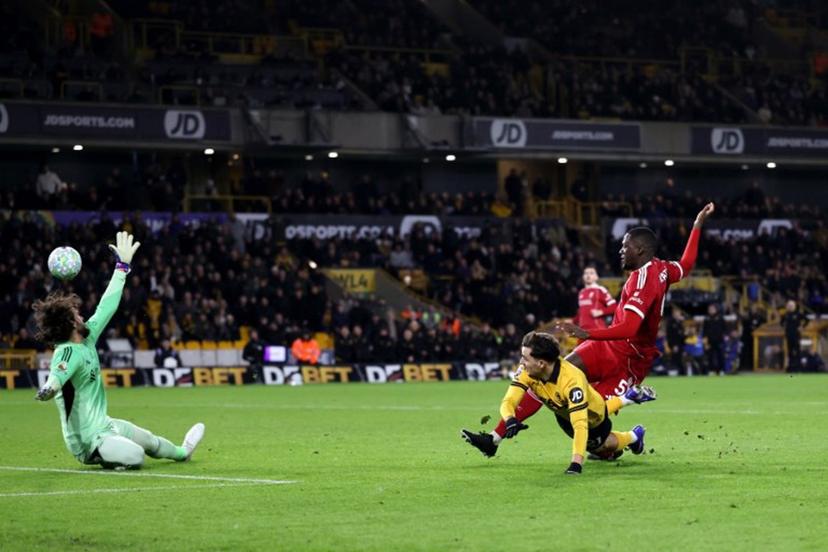 Wolverhampton Wanderers' Portugese midfielder #21 Rodrigo Gomes scores the team's first goal during the English Premier League football match between Wolverhampton Wanderers and Liverpool at the Molineux stadium in Wolverhampton, central England on March 3, 2026. Darren Staples / AFP