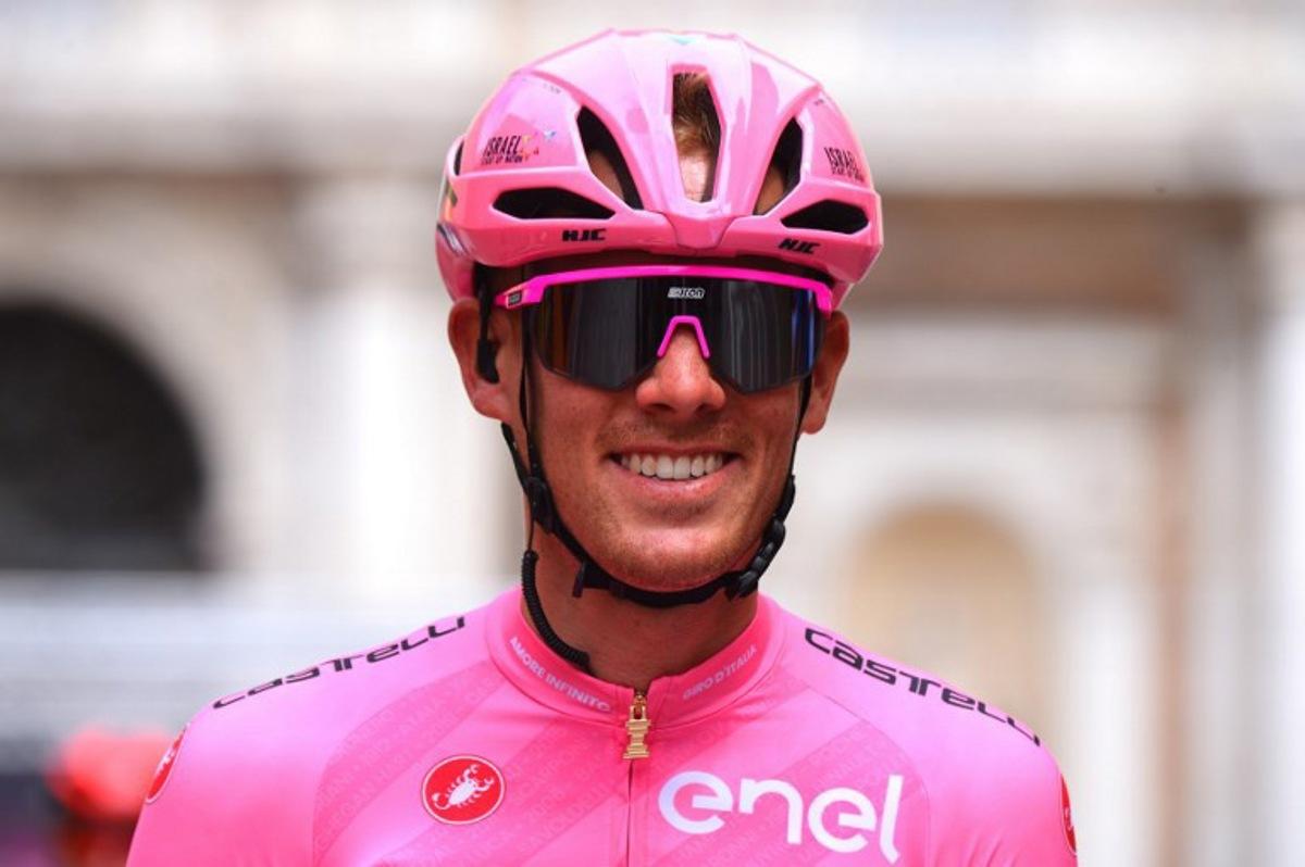Team Israel Start-Up Nation rider Italy's Alessandro De Marchi, wearing the overall leader's pink jersey, smiles at the start of the fifth stage of the Giro d'Italia 2021 cycling race, 177 km between Modena and Cattolica, Emilia-Romagna, on May 12, 2021. Dario BELINGHERI / AFP