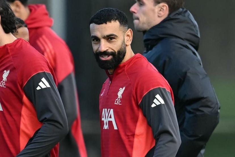 (FILES) Liverpool's Egyptian striker #11 Mohamed Salah attends a team training session at their training ground in Kirkby, Liverpool, north-west England on December 8, 2025, on the eve of their UEFA Champions League, league phase football match against Inter Milan in Milan. Liverpool boss Arne Slot said he would speak to Mohamed Salah on December 12, 2025 before deciding on the forward's availability for this weekend's match against Brighton. Paul ELLIS / AFP