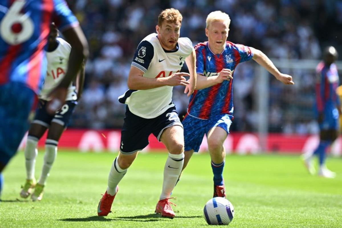 Tottenham Hotspur's Swedish midfielder #21 Dejan Kulusevski (L) runs away from Crystal Palace's English midfielder #19 Will Hughes (R) during the English Premier League football match between Tottenham Hotspur and Crystal Palace at the Tottenham Hotspur Stadium in London, on May 11, 2025. Ben STANSALL / AFP