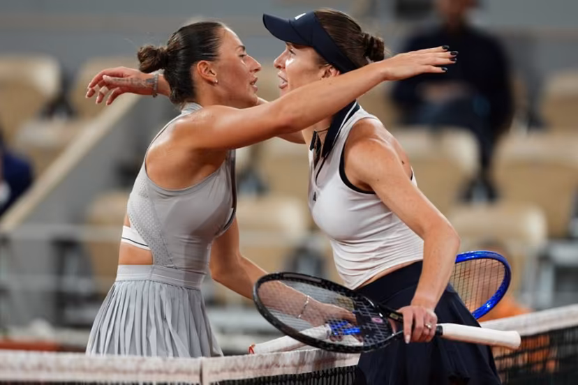 Ukraine's Marta Kostyuk (L) and Ukraine's Elina Svitolina (R) embrace at the end of their women's quarter final singles match on day 10 of the French Open tennis tournament on Court Philippe-Chatrier at the Roland-Garros Complex in Paris on June 2, 2026. Dimitar DILKOFF / AFP